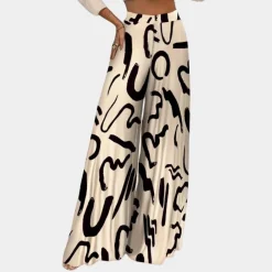 Broeken & Rokken Dames*Ruby - Luchtige damesbroek met artistieke vloeiing en wijde pijpen voor de zomer