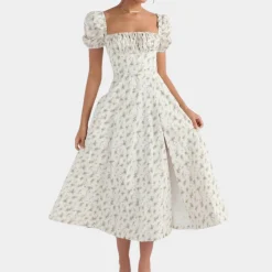 Jurken & Jumpsuits Dames*Sylvie - Zomerse gebloemde damesjurk met split